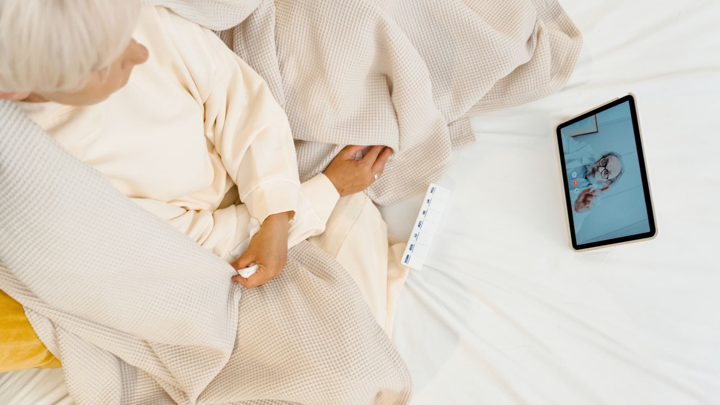 Healthcare professionals using telehealth technology to review patient care